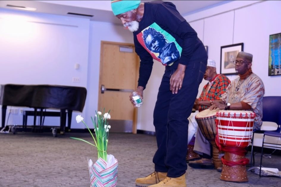 A performer moving to the drums during the Kwanzaa celebration
